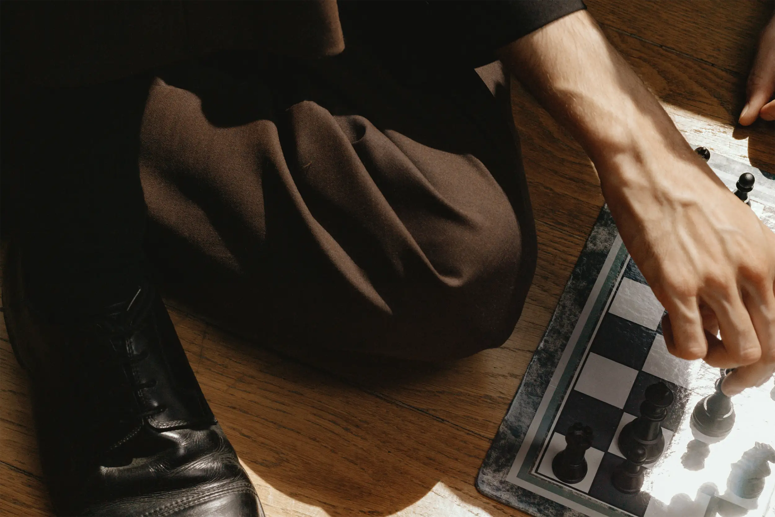 person playing chess on the floor