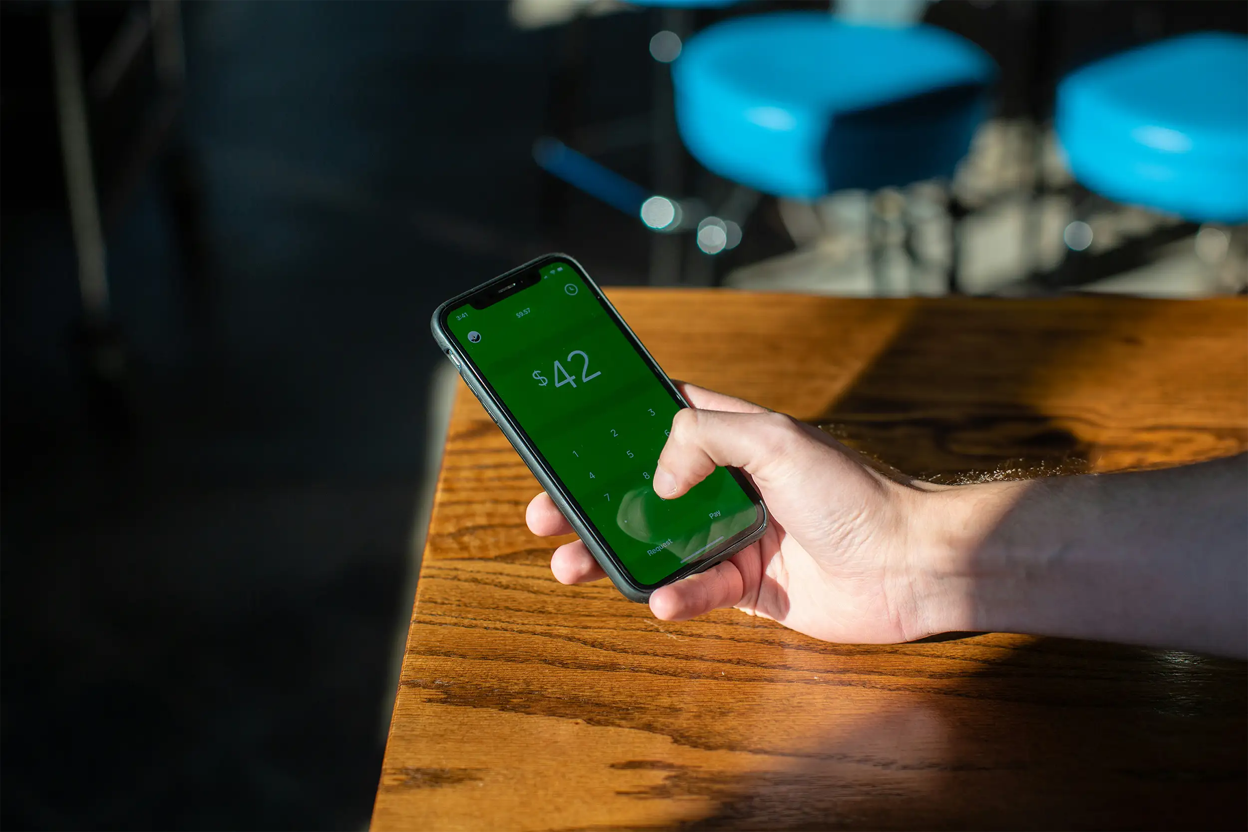 person holding a phone checking out