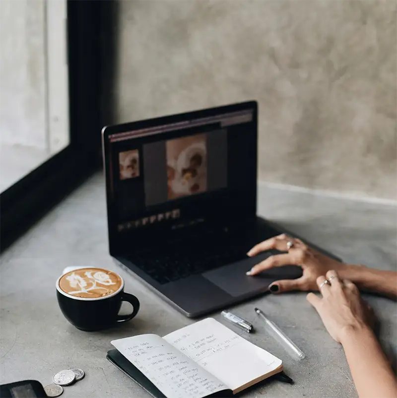 person using laptop on a table