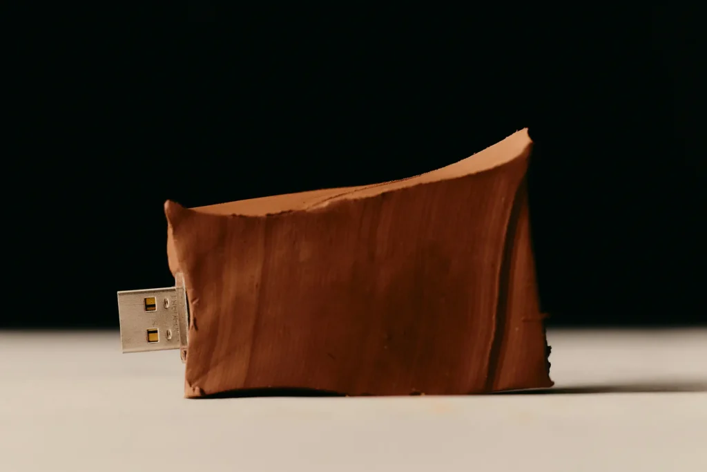 USB drive plugged into clay
