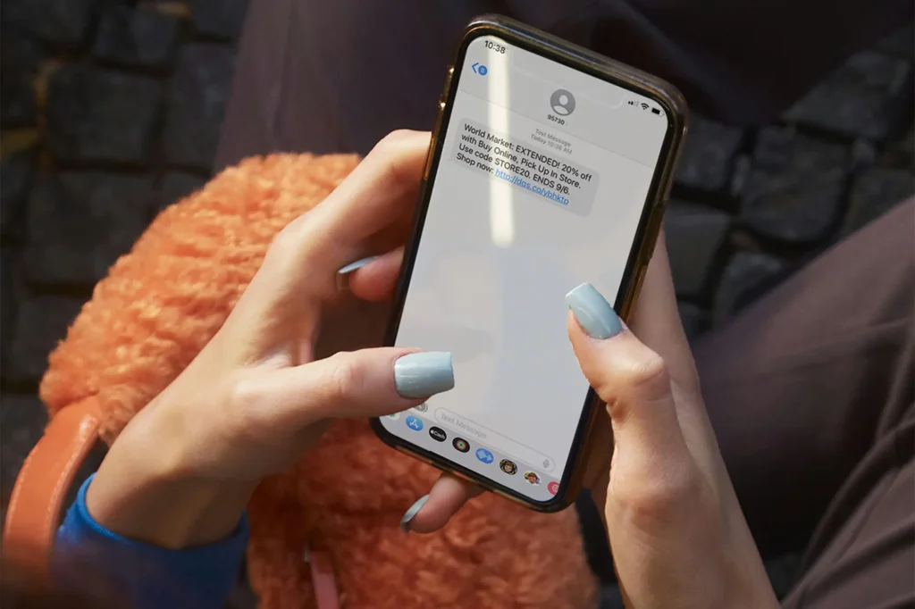 woman holding phone and texting