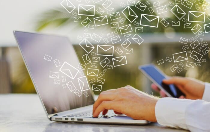 A man checking is email on his laptop computer.