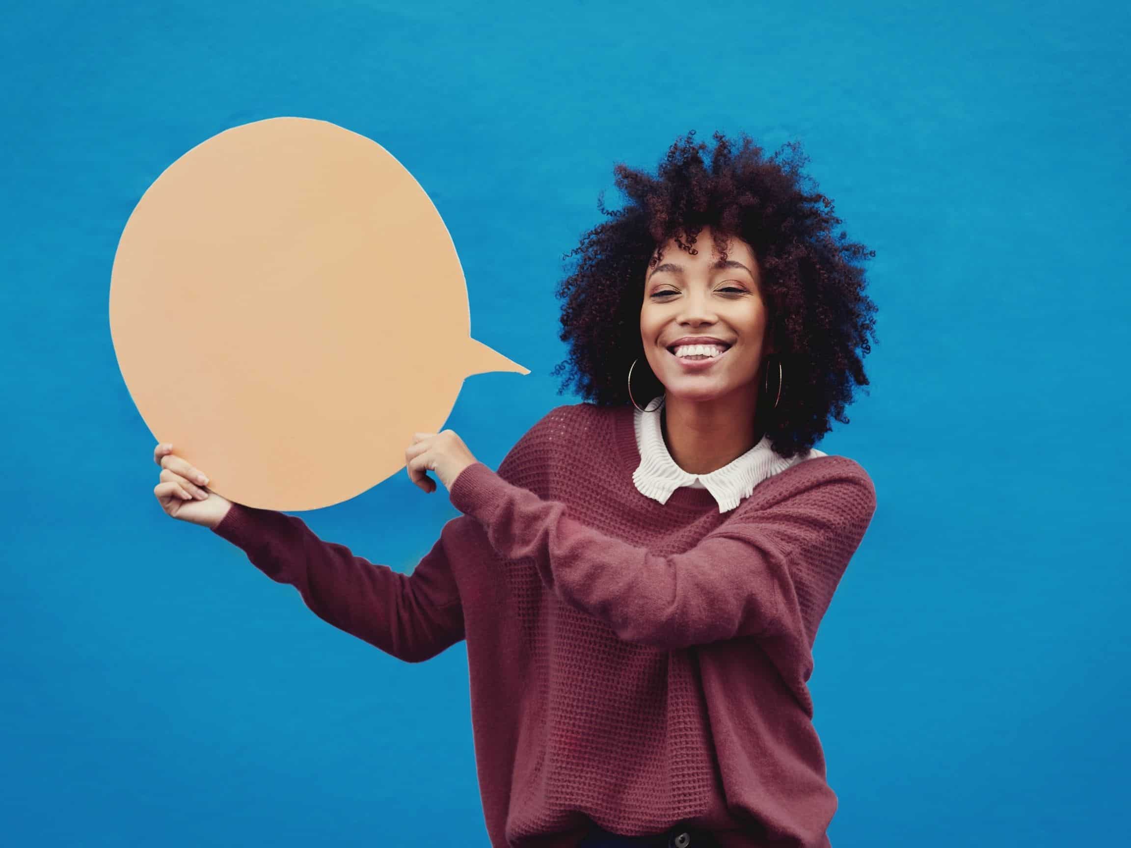 woman holding conversation bubble