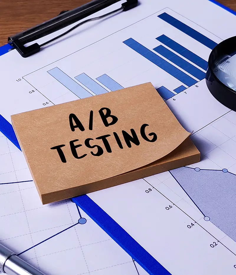sticky notes that say A/B Testing on top of charts and graphs