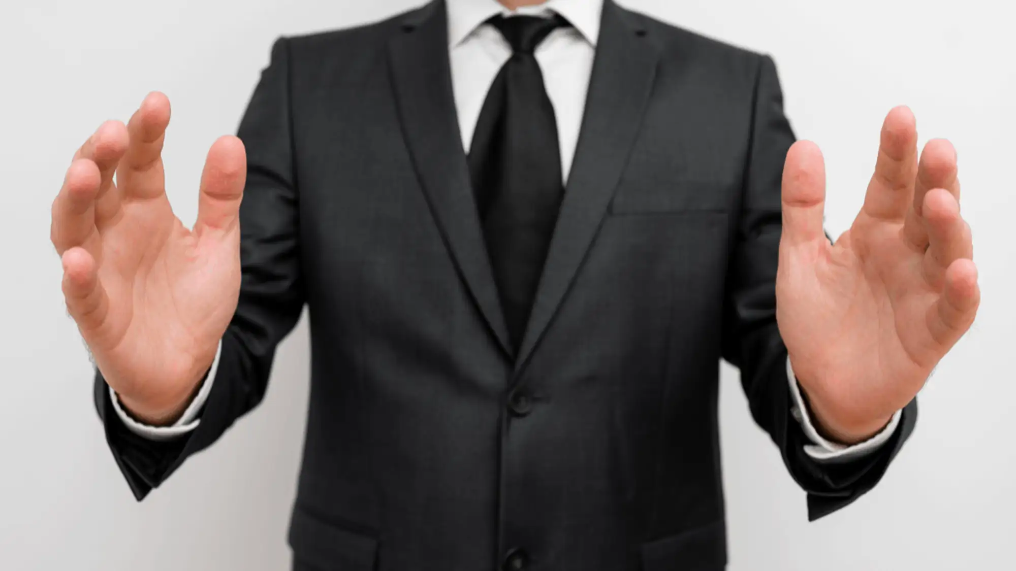 business man holding hands up