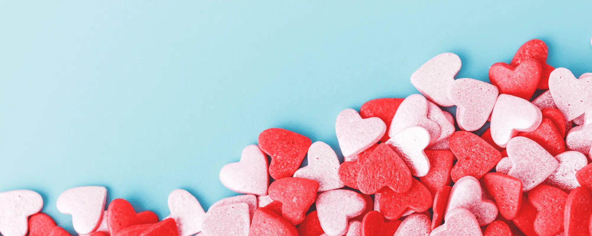 candy hearts on blue background