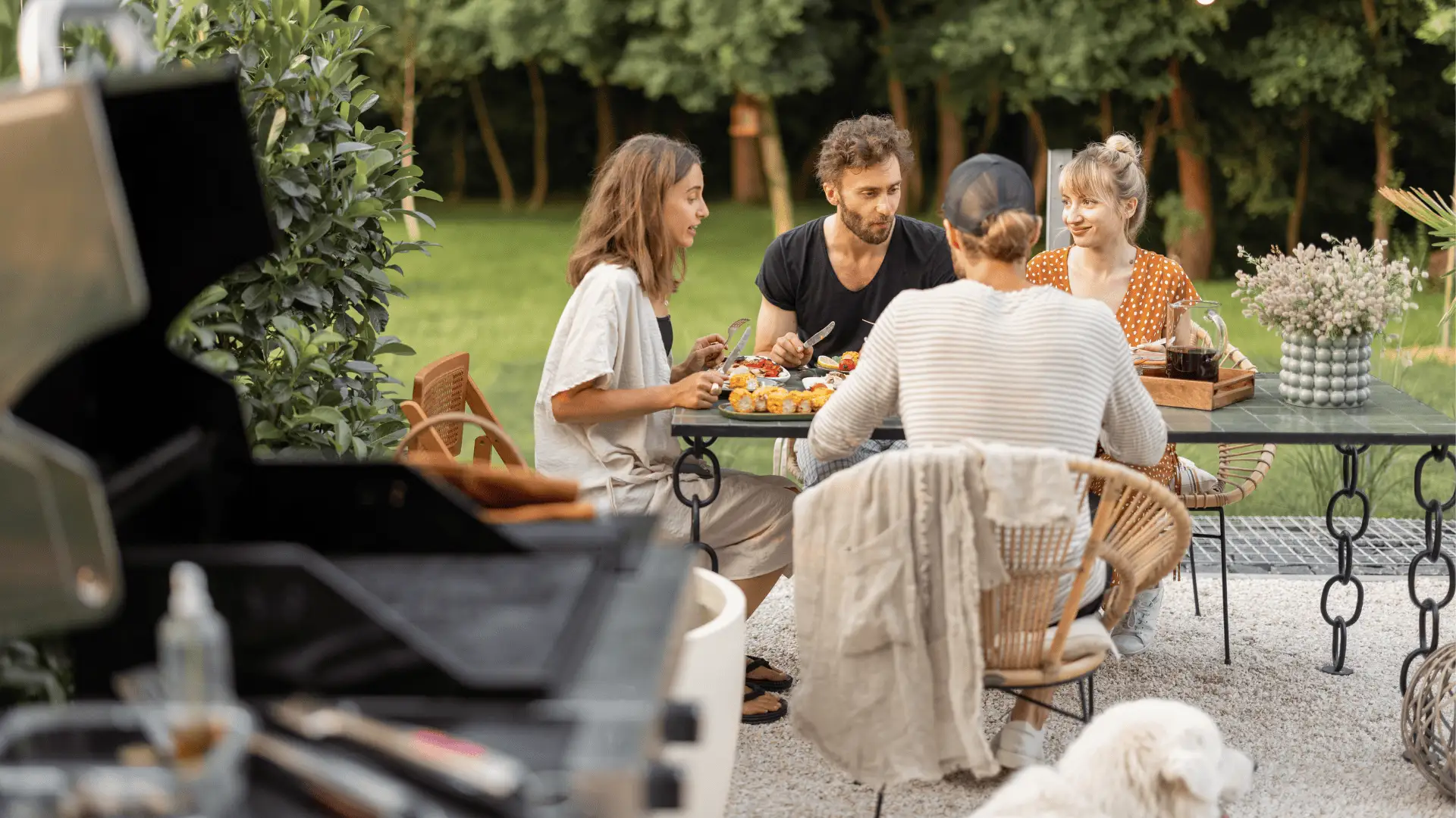 friends eating outside at a glass table