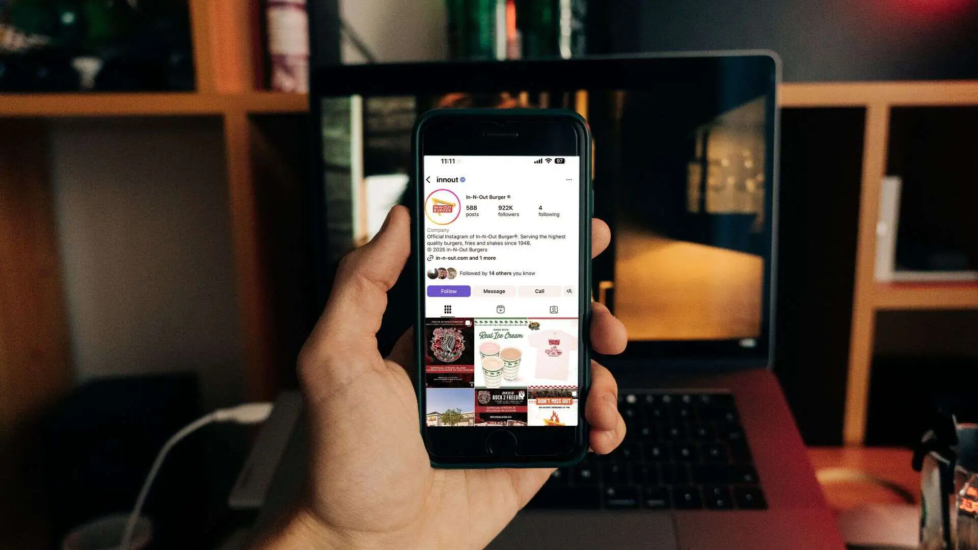 hand holding a phone with Instagram open