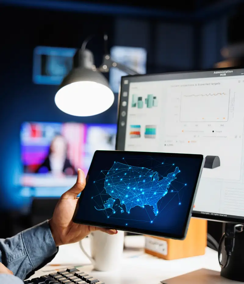 holding a tablet with national data points