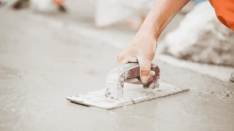 trowel smoothing out cement