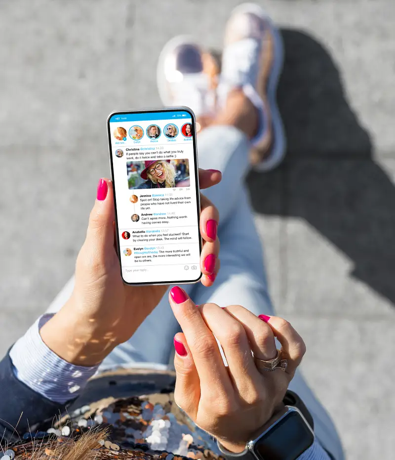 woman looking at socials on her phone