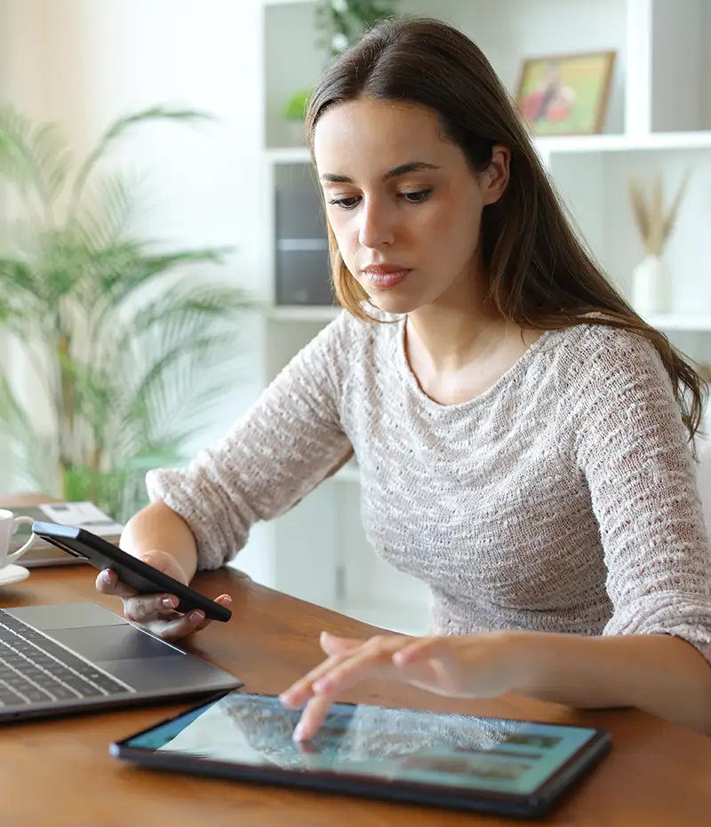 woman on phone and tablet