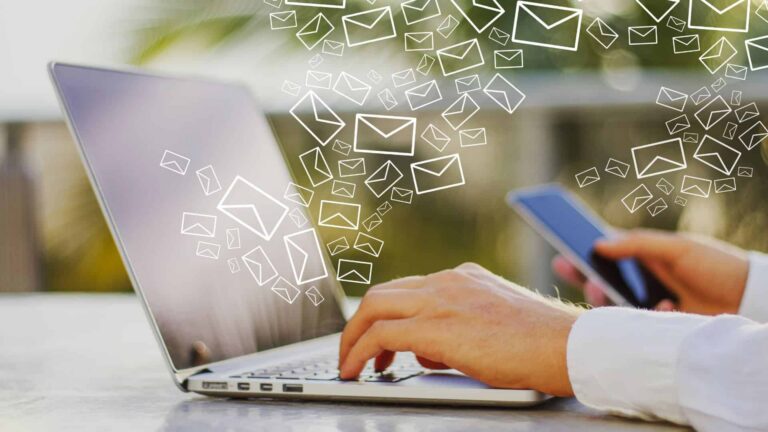 laptop with email icons flying out from the keyboard