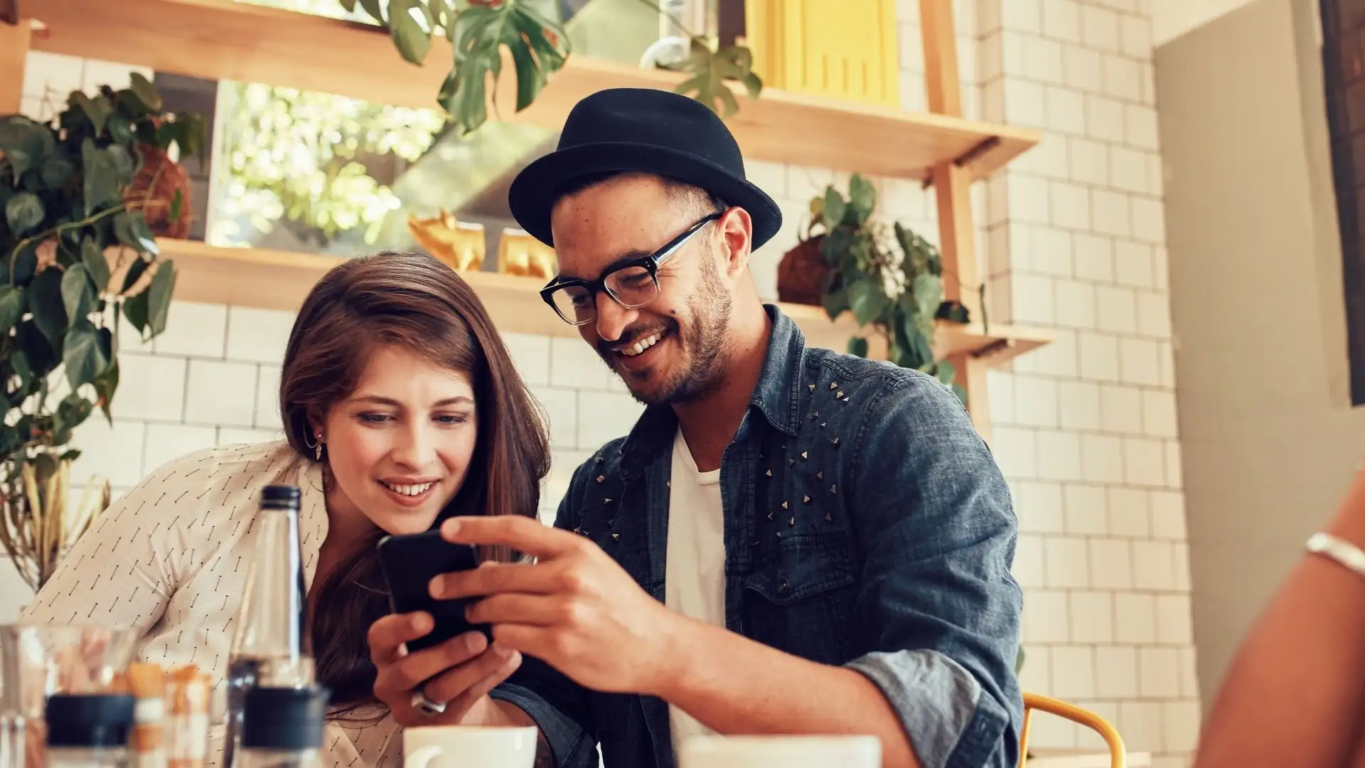 two people looking at a phone