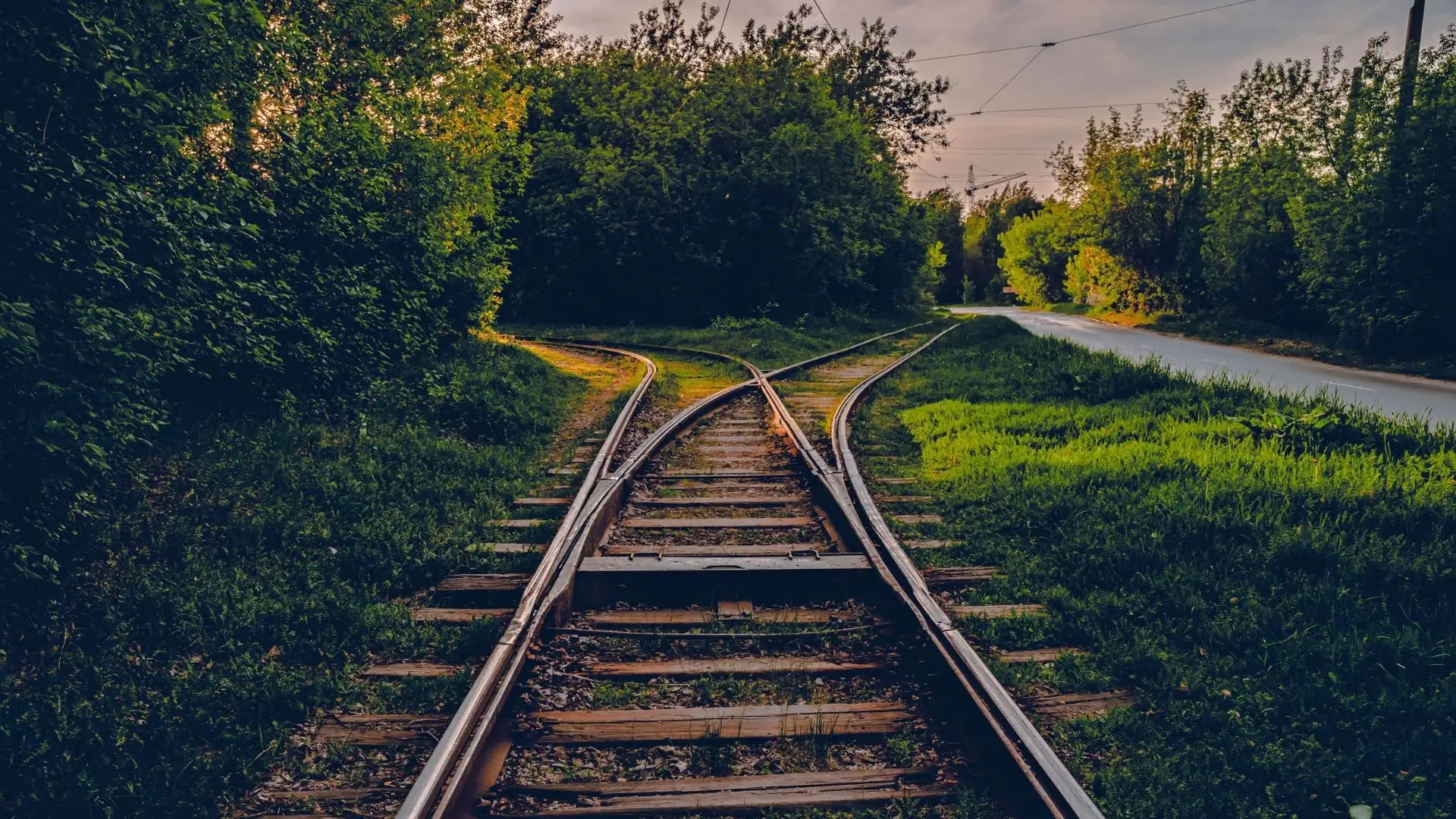 railroad tracks running next to a road